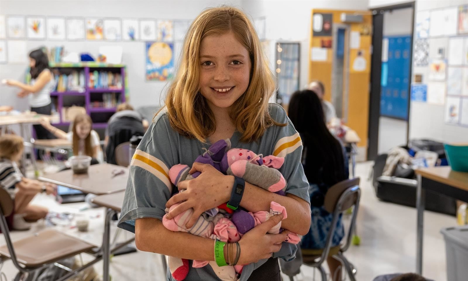  Student holding cat toys